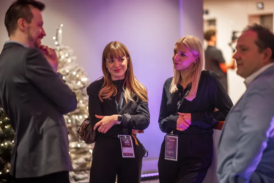 Smiling participants talking in the lobby at the Marketing Innovation Executive Summit 2024