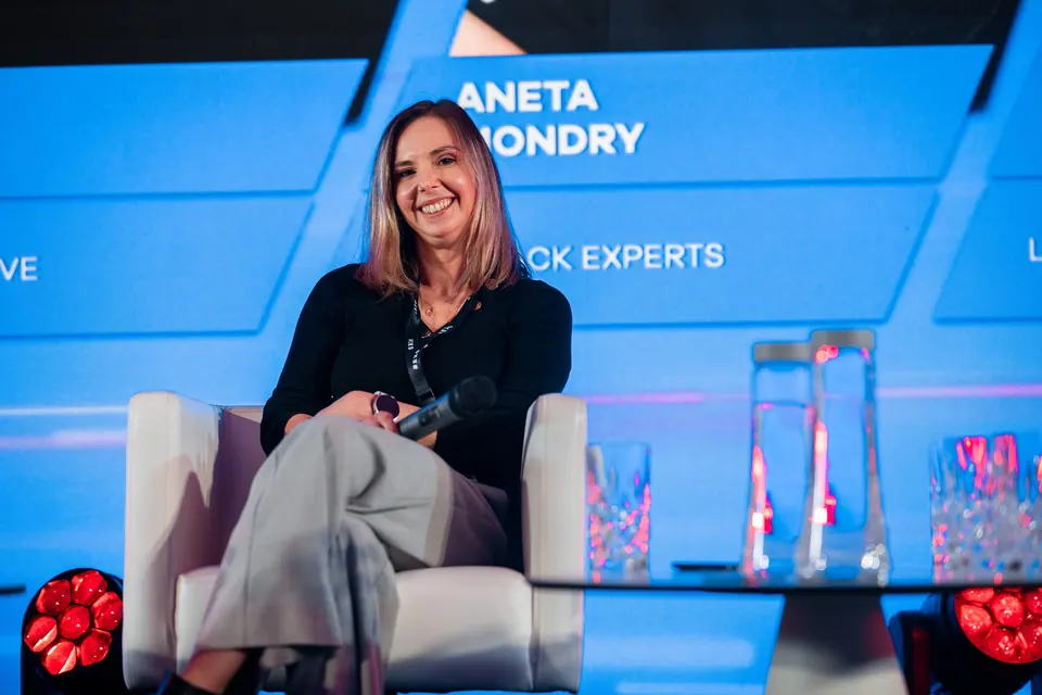 A panellist with a broad smile on the Marketing Innovation Executive Summit 2024 stage